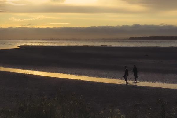Paddling in Sunset Waters - Nesta James