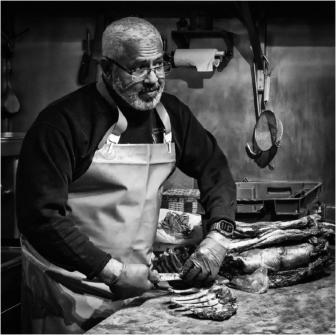 Butcher at work - David Egerton