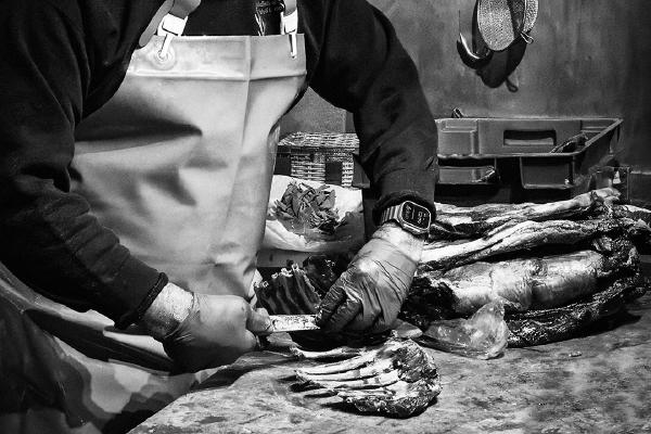Butcher at work - David Egerton